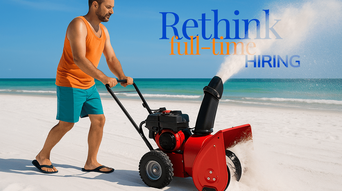 A Florida-man uses a snow-blower on a white-sand beach with the ocean in the background.