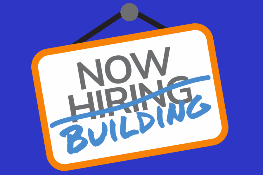 an illustration of a "now hiring" sign with the word "hiring" crossed off and the word "building" written in handwriting. The sign is white and orange, the handwritten word is light blue.