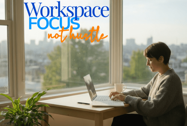 a woman sits at her office desk and focuses on her computer and notes