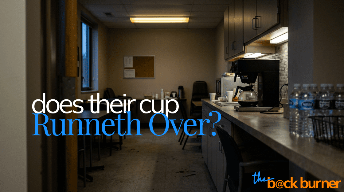 a photograph of an office break room with a nearly empty coffee pot on the counter. The break room looks shabby and unattractive, highlighting that the team is at capacity.