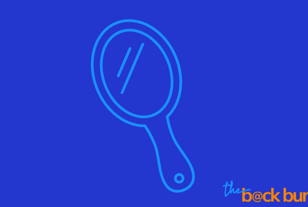 a line drawing of a hand-held mirror. Touching on the theme of the piece, that your biggest competition is the person in the mirror